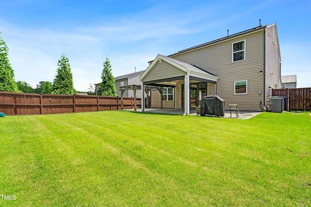 rear view of house with a patio and central air condition unit