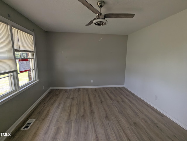 1064 Abbott Rd, Henderson, NC 27537 - spare room featuring wood finished floors, ceiling fan, and baseboards