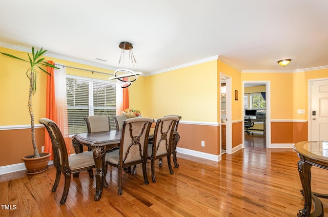 412 Collington Dr, Mebane, NC 27302 - dining area with light wood-style flooring, ornamental molding, and baseboards
