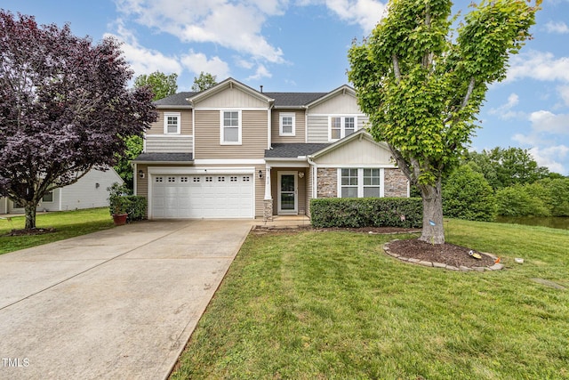 412 Collington Dr, Mebane, NC 27302 - view of front facade featuring stone siding, concrete driveway, a garage, and a front lawn