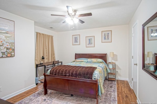 669 Bartons Landing Pl Unit 7, Fayetteville, NC 28314 - bedroom with wood finished floors, a ceiling fan, and baseboards