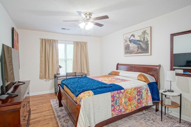 669 Bartons Landing Pl Unit 7, Fayetteville, NC 28314 - bedroom featuring light wood-style flooring, baseboards, and a ceiling fan
