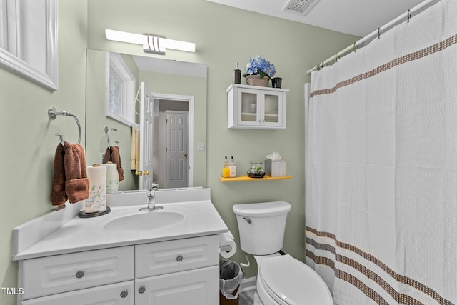 11013 Louson Pl, Raleigh, NC 27614 - full bathroom with vanity, toilet, and a shower with curtain