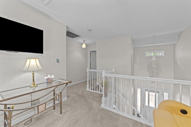 11013 Louson Pl, Raleigh, NC 27614 - hallway featuring carpet flooring, an upstairs landing, and baseboards