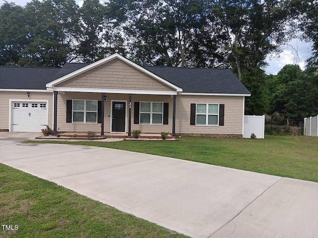 31 Kevior Ave, Four Oaks, NC 27524 - view of front of property with a porch, a garage, and concrete driveway