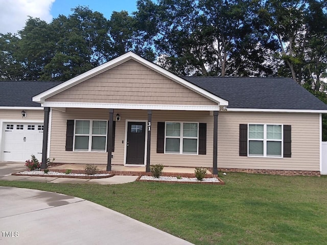 31 Kevior Ave, Four Oaks, NC 27524 - view of front of property with covered porch, an attached garage, a front yard, and concrete driveway