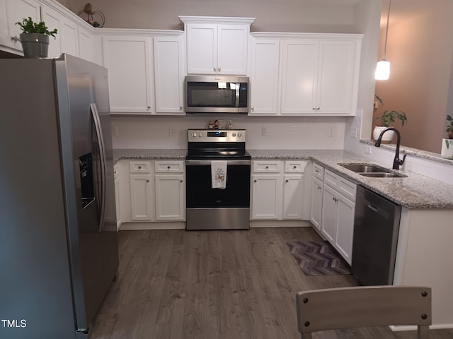 31 Kevior Ave, Four Oaks, NC 27524 - kitchen featuring appliances with stainless steel finishes, a sink, white cabinets, and dark wood finished floors