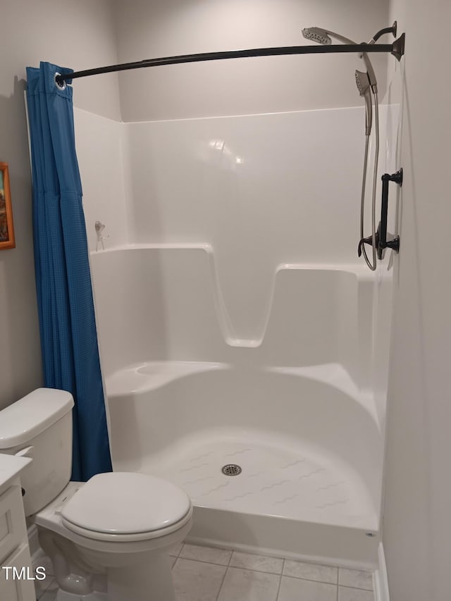 31 Kevior Ave, Four Oaks, NC 27524 - bathroom with toilet, a shower stall, vanity, and tile patterned flooring