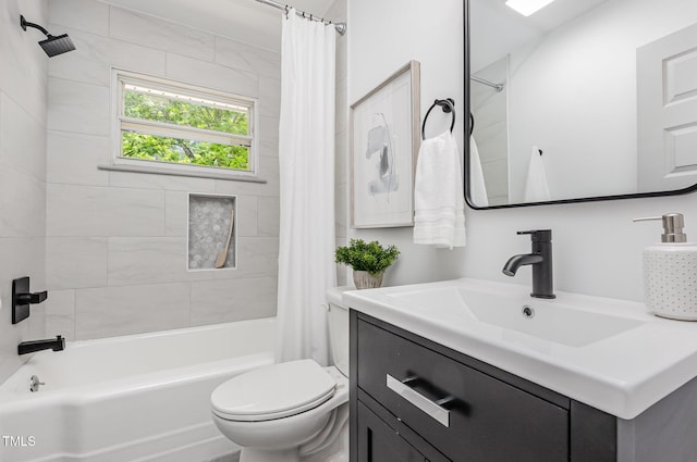 full bath featuring toilet, shower / tub combo with curtain, and vanity