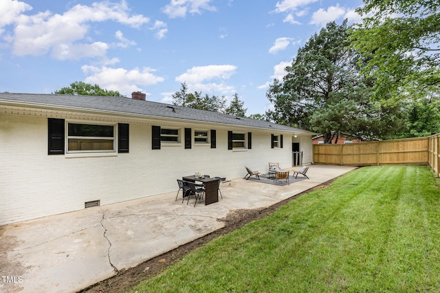 rear view of property with a patio area, a chimney, and brick siding