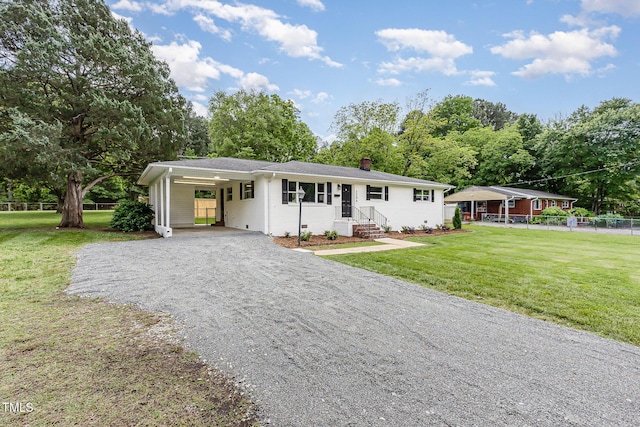 ranch-style home featuring gravel driveway, a chimney, entry steps, and a carport