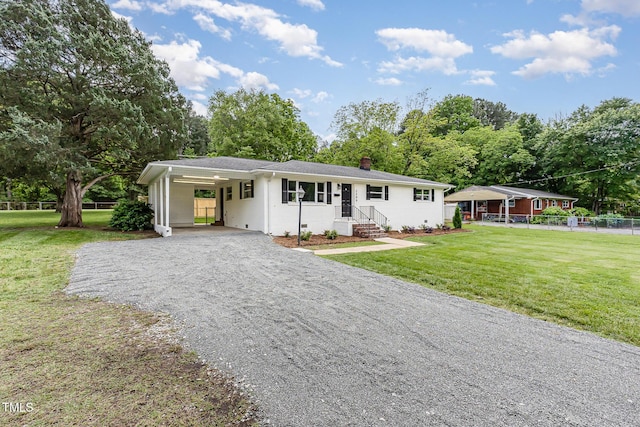 2205 W Carver St, Durham, NC 27705 - ranch-style home featuring gravel driveway, a chimney, a carport, and entry steps
