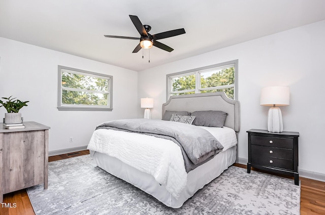 2205 W Carver St, Durham, NC 27705 - bedroom featuring baseboards, wood finished floors, and ceiling fan