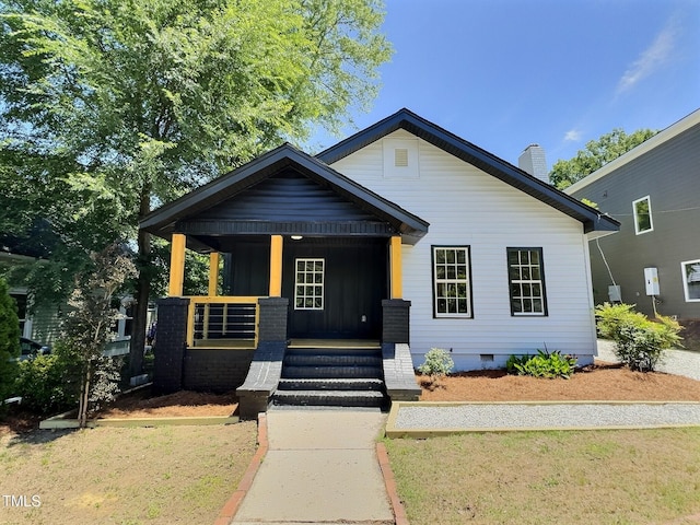114 N Guthrie Ave, Durham, NC 27703 - view of front of property with covered porch, crawl space, a chimney, and a front yard