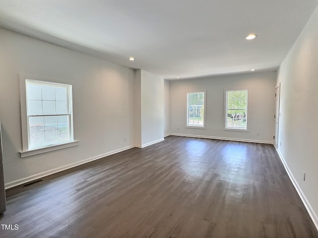 114 N Guthrie Ave, Durham, NC 27703 - empty room featuring dark wood-style flooring, recessed lighting, and baseboards