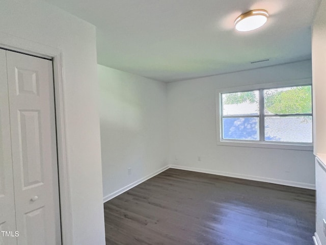 114 N Guthrie Ave, Durham, NC 27703 - empty room with dark wood-style floors and baseboards