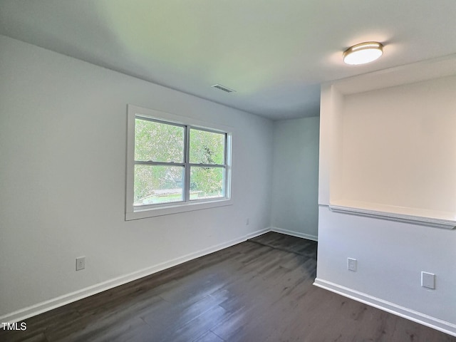 114 N Guthrie Ave, Durham, NC 27703 - unfurnished room with dark wood-type flooring and baseboards