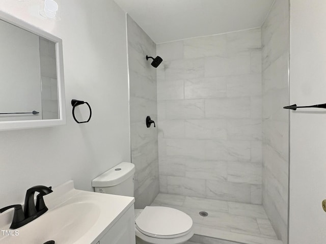114 N Guthrie Ave, Durham, NC 27703 - bathroom featuring toilet, tiled shower, vanity, and marble finish floors