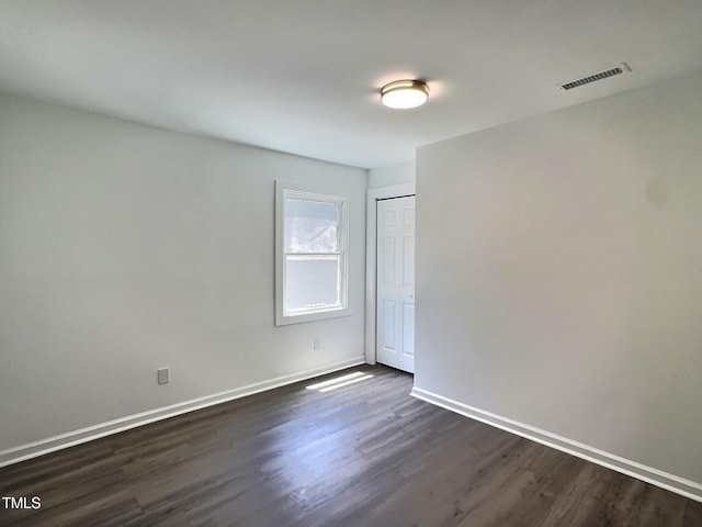 114 N Guthrie Ave, Durham, NC 27703 - unfurnished room featuring dark wood-type flooring and baseboards