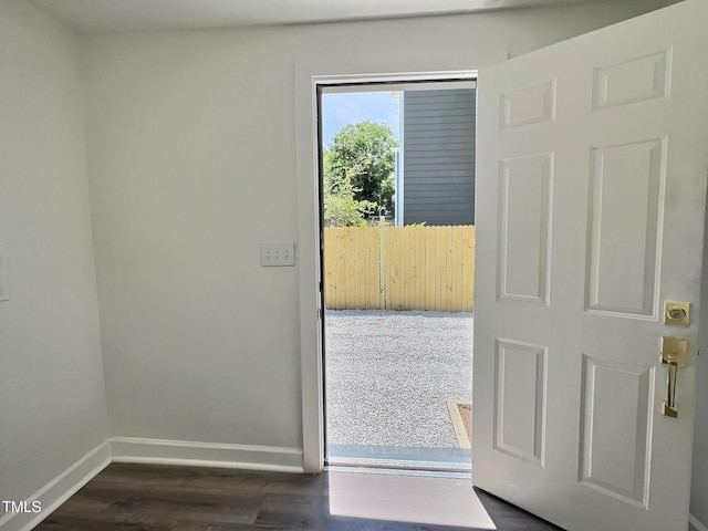 114 N Guthrie Ave, Durham, NC 27703 - doorway to outside with baseboards and dark wood-style floors