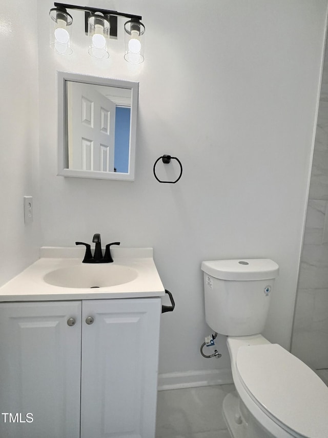 114 N Guthrie Ave, Durham, NC 27703 - bathroom featuring toilet, vanity, and baseboards