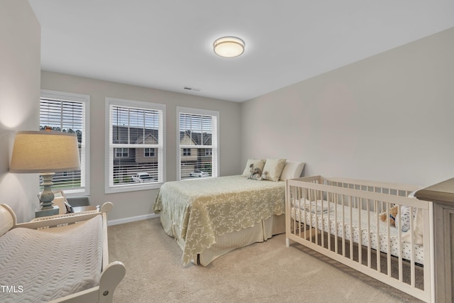 bedroom with carpet flooring and baseboards