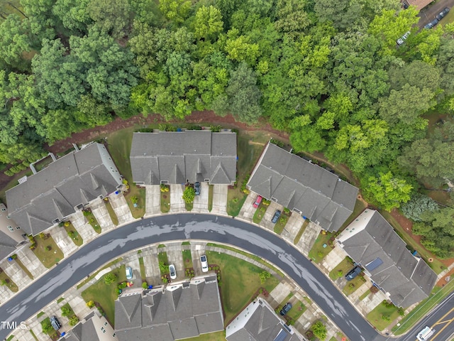 aerial view of property and surrounding area with nearby suburban area