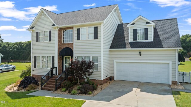 115 Spring Branch Dr, Four Oaks, NC 27524 - view of front of house with driveway, a front yard, a garage, and roof with shingles