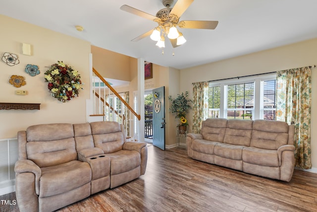 115 Spring Branch Dr, Four Oaks, NC 27524 - living area with stairway, wood finished floors, a ceiling fan, and baseboards