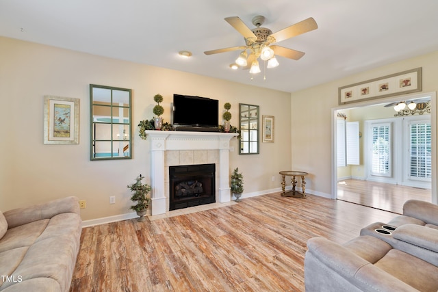 115 Spring Branch Dr, Four Oaks, NC 27524 - living area with wood finished floors, a ceiling fan, a fireplace, and baseboards