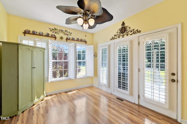 115 Spring Branch Dr, Four Oaks, NC 27524 - doorway featuring a ceiling fan, wood finished floors, and baseboards