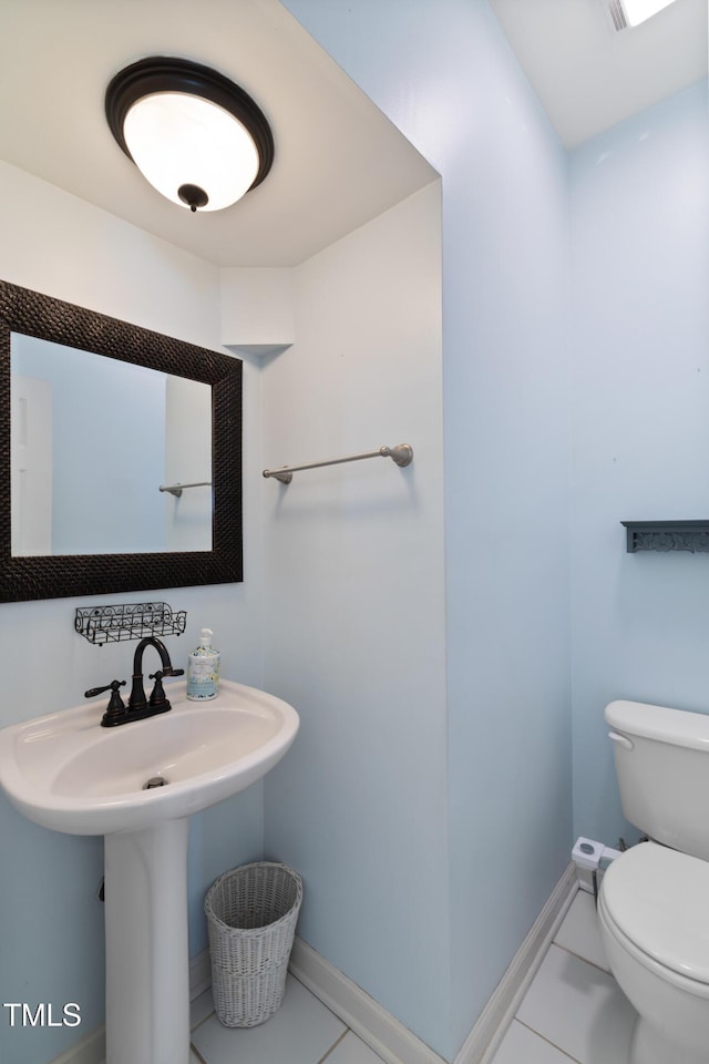 115 Spring Branch Dr, Four Oaks, NC 27524 - bathroom featuring toilet, baseboards, and tile patterned floors