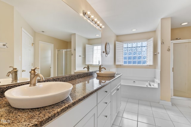 115 Spring Branch Dr, Four Oaks, NC 27524 - bathroom featuring a shower stall, a garden tub, double vanity, tile patterned floors, and recessed lighting