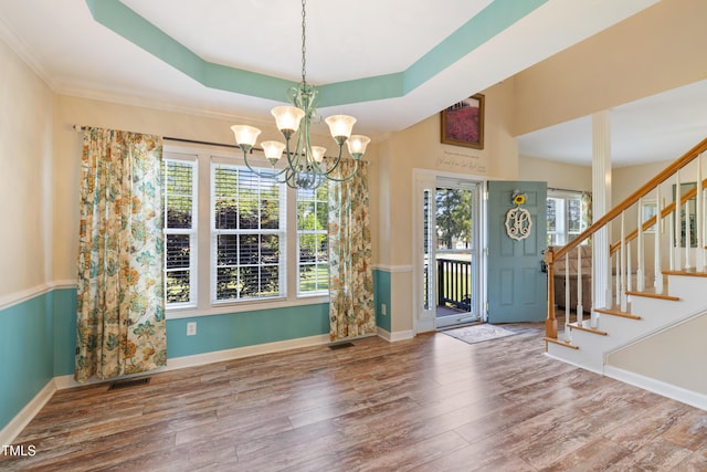 115 Spring Branch Dr, Four Oaks, NC 27524 - entryway with plenty of natural light, a chandelier, wood finished floors, and stairway