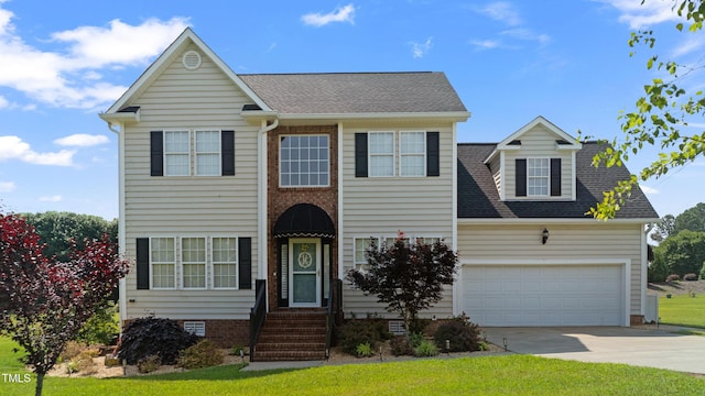 115 Spring Branch Dr, Four Oaks, NC 27524 - view of front of property with concrete driveway, roof with shingles, a garage, and a front yard