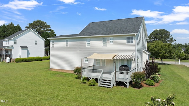 115 Spring Branch Dr, Four Oaks, NC 27524 - back of property featuring a lawn, a wooden deck, and a shingled roof
