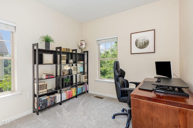 home office with carpet floors and baseboards