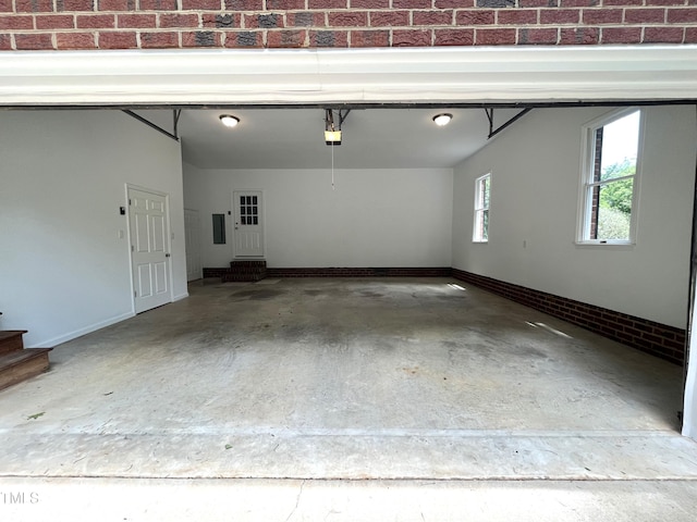 garage featuring baseboards and a garage door opener