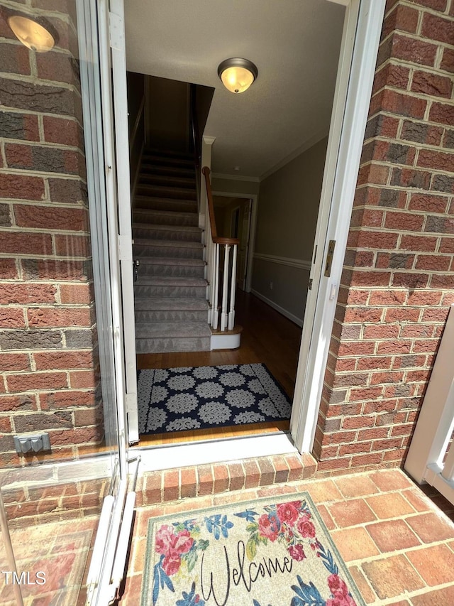 entrance to property with brick siding