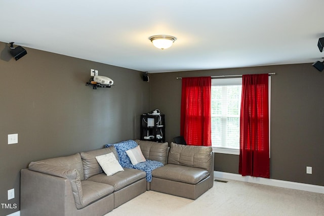 living room featuring carpet floors and baseboards
