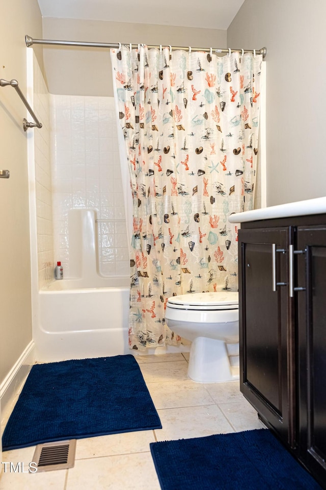 full bathroom featuring toilet, shower / bath combo with shower curtain, vanity, and tile patterned floors