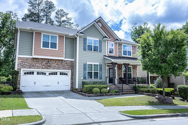 craftsman house with concrete driveway, a garage, stone siding, and covered porch