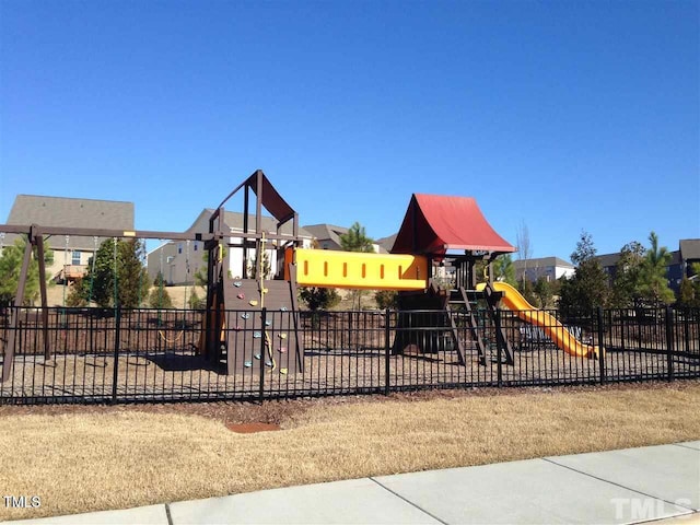 community jungle gym with fence