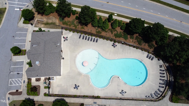view of property location with a pool