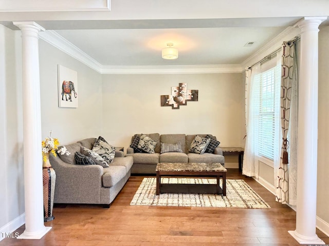 5016 Trembath Ln, Cary, NC 27519 - living room featuring decorative columns, wood finished floors, crown molding, and baseboards