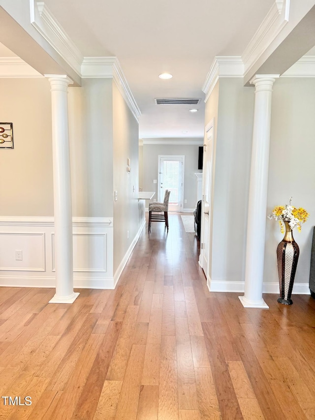 5016 Trembath Ln, Cary, NC 27519 - hall with ornate columns, light wood-style flooring, ornamental molding, baseboards, and recessed lighting