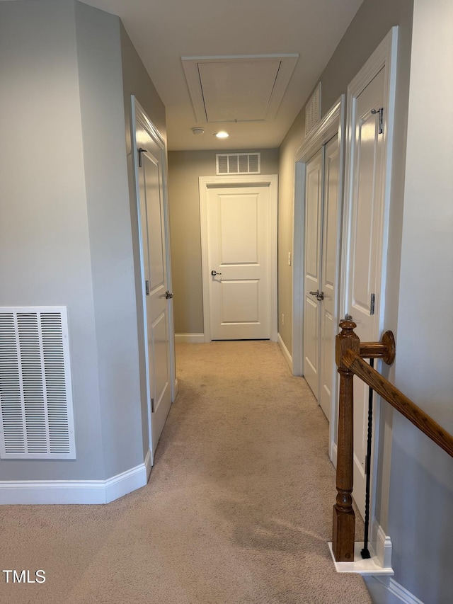 5016 Trembath Ln, Cary, NC 27519 - hallway with attic access, light carpet, and baseboards