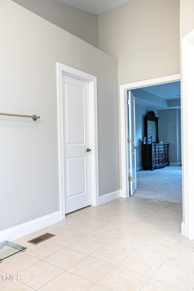 5016 Trembath Ln, Cary, NC 27519 - spare room with light tile patterned floors, baseboards, and a wood stove