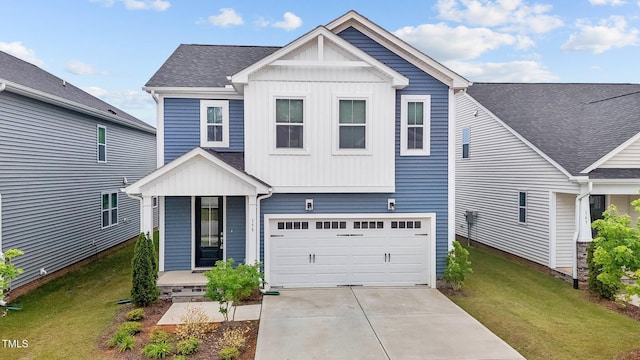 159 Wood Orchid Ln, Garner, NC 27529 - view of front facade with a front lawn, driveway, board and batten siding, and a garage