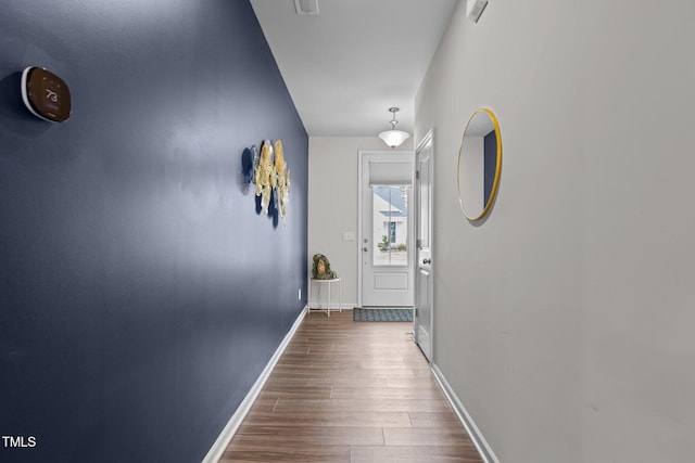 159 Wood Orchid Ln, Garner, NC 27529 - corridor with dark wood-type flooring and baseboards